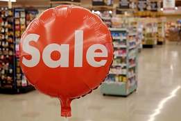 red sale balloon in grocery store